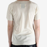 white t-shirt worn by a person, showing the t-shirt fit