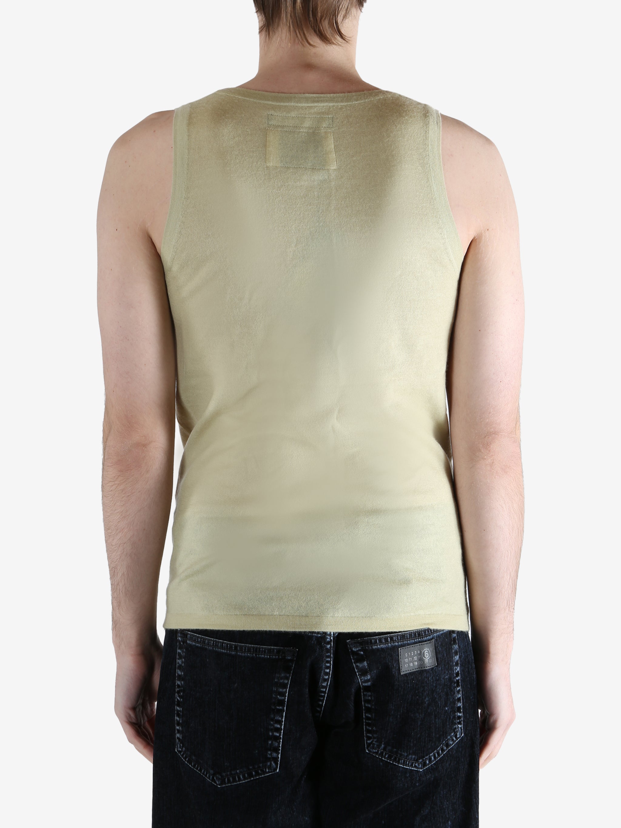 Tan top worn by a person, showing the top fit