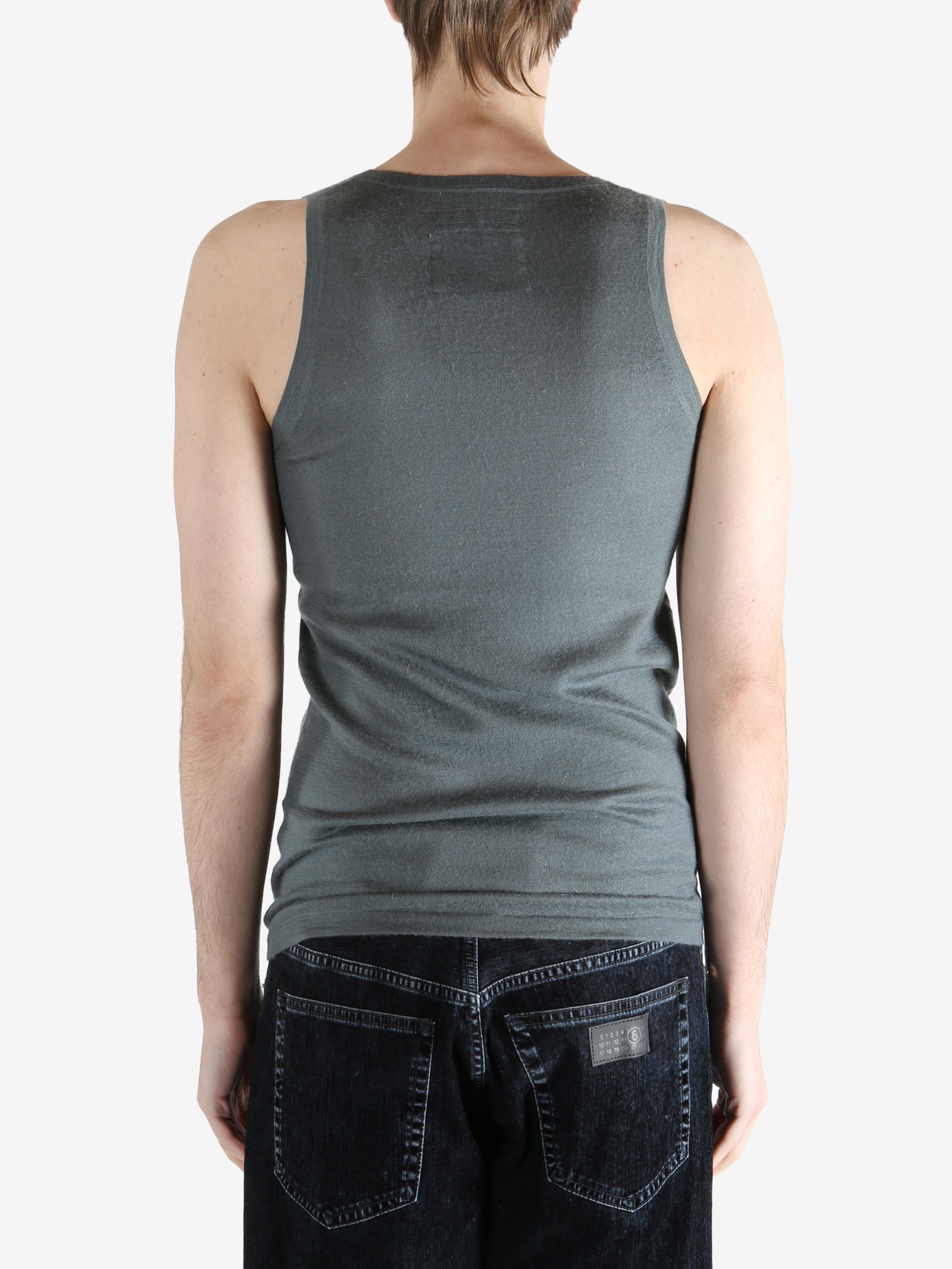 Grey top worn by a person, showing the top fit
