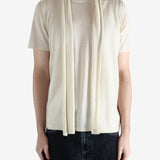 White top worn by a person, showing the top fit