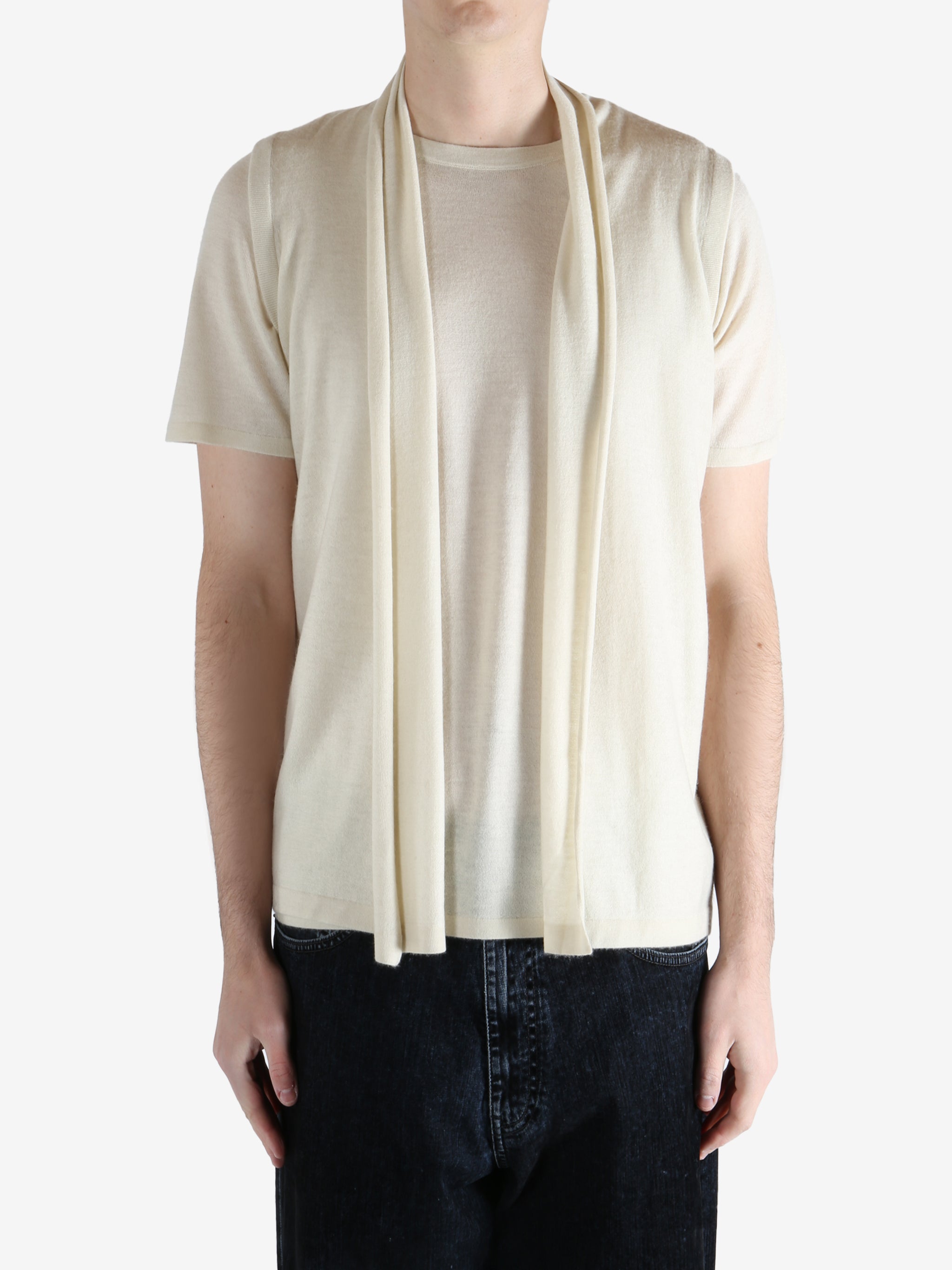 White top worn by a person, showing the top fit