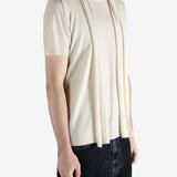 White top worn by a person, showing the top fit