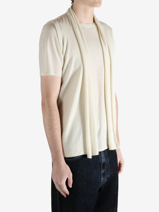 White top worn by a person, showing the top fit