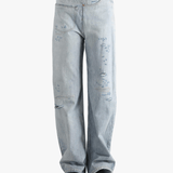 Blue jean  worn by a person, showing the jean 's fit