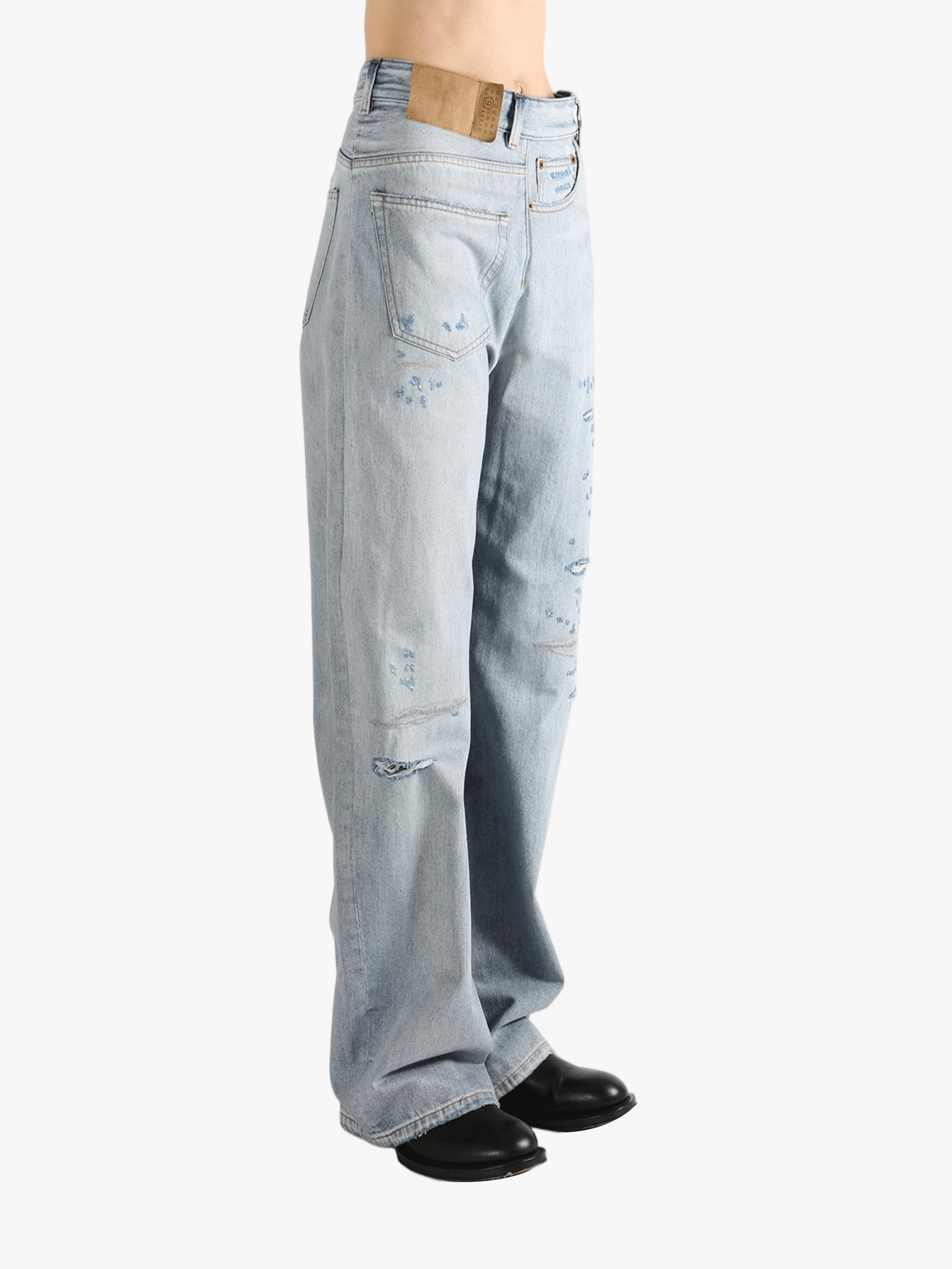 Blue jean  worn by a person, showing the jean 's fit