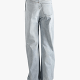 Blue jean  worn by a person, showing the jean 's fit