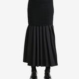 Black skirt worn by a person,showing the skirt's fit