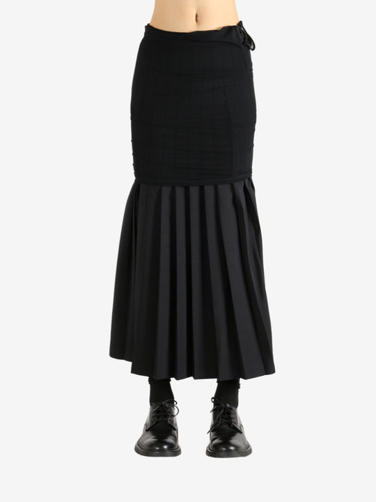 Black skirt worn by a person,showing the skirt's fit