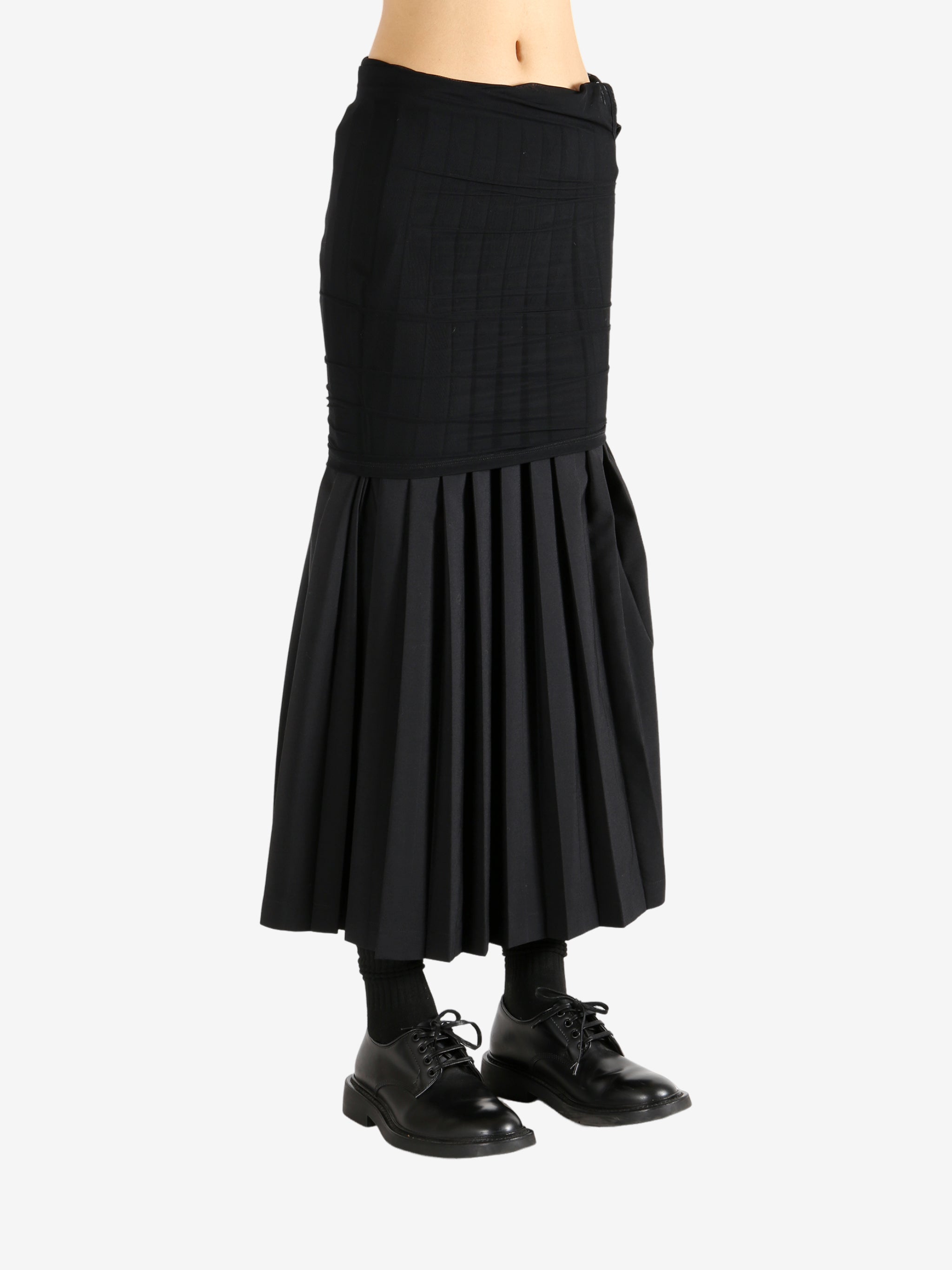 Black skirt worn by a person,showing the skirt's fit