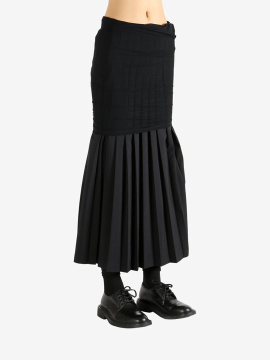 Black skirt worn by a person,showing the skirt's fit