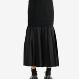 Black skirt worn by a person,showing the skirt's fit