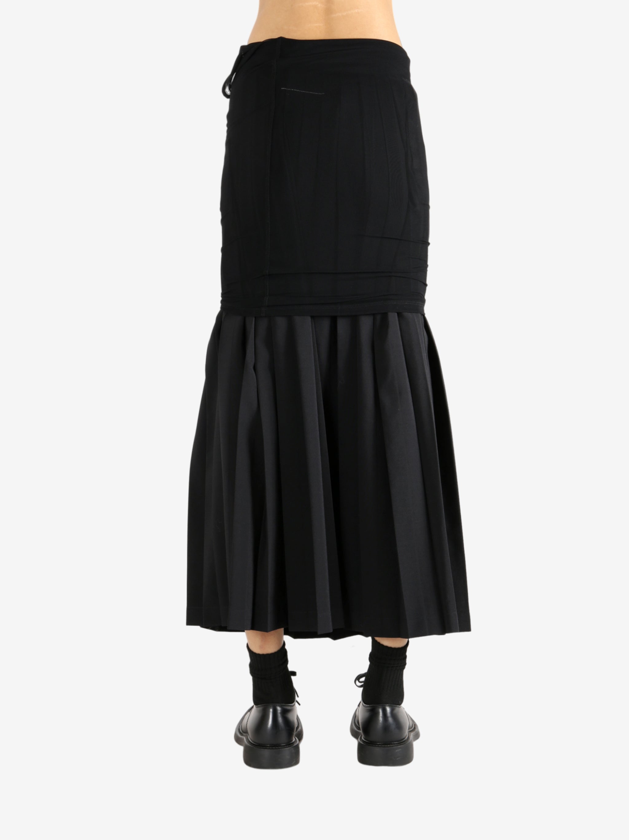 Black skirt worn by a person,showing the skirt's fit
