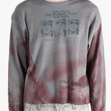 Grey top worn by a person, showing the top'sfit