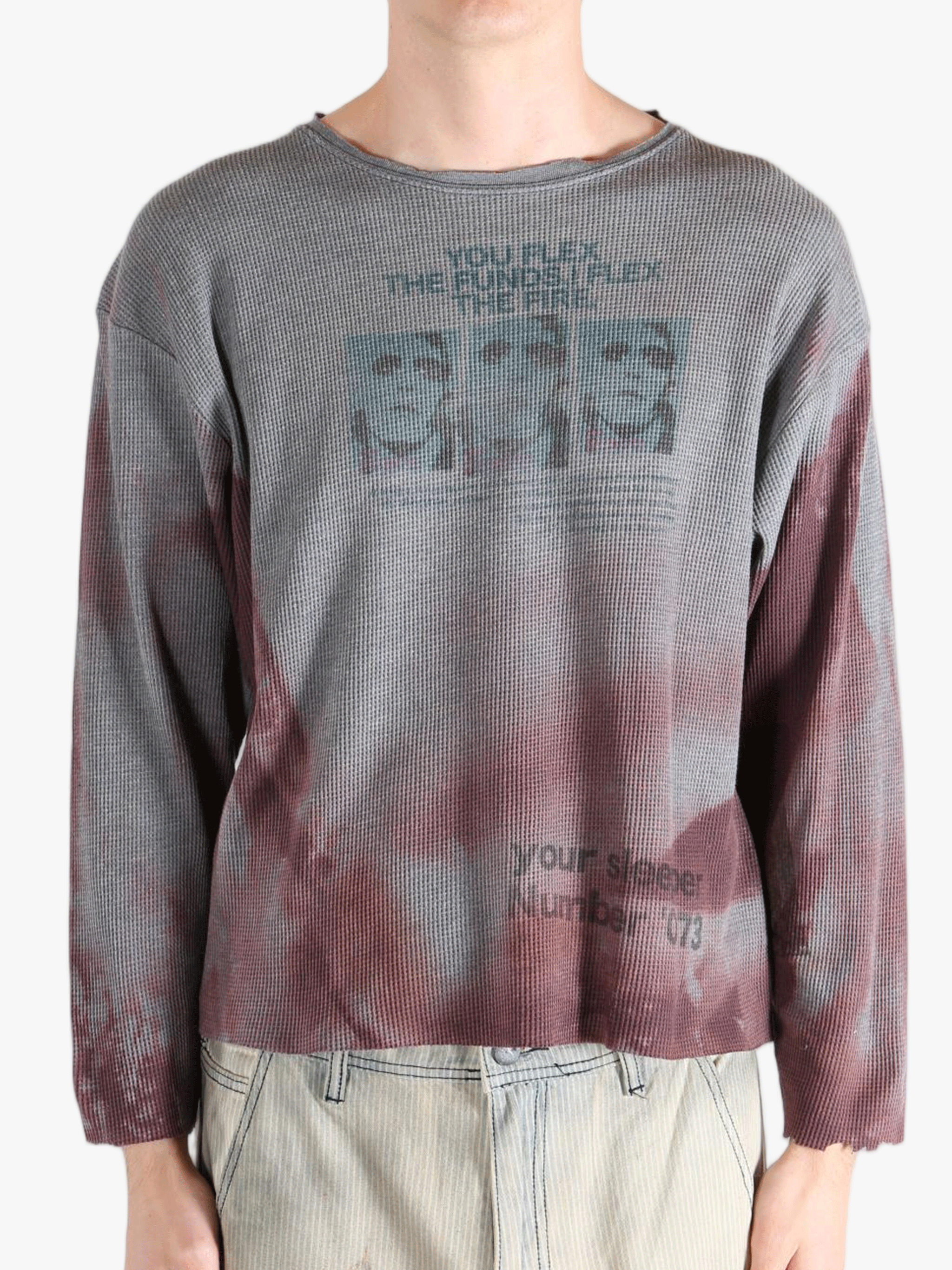 Grey top worn by a person, showing the top'sfit