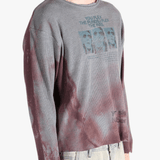 Grey top worn by a person, showing the top'sfit