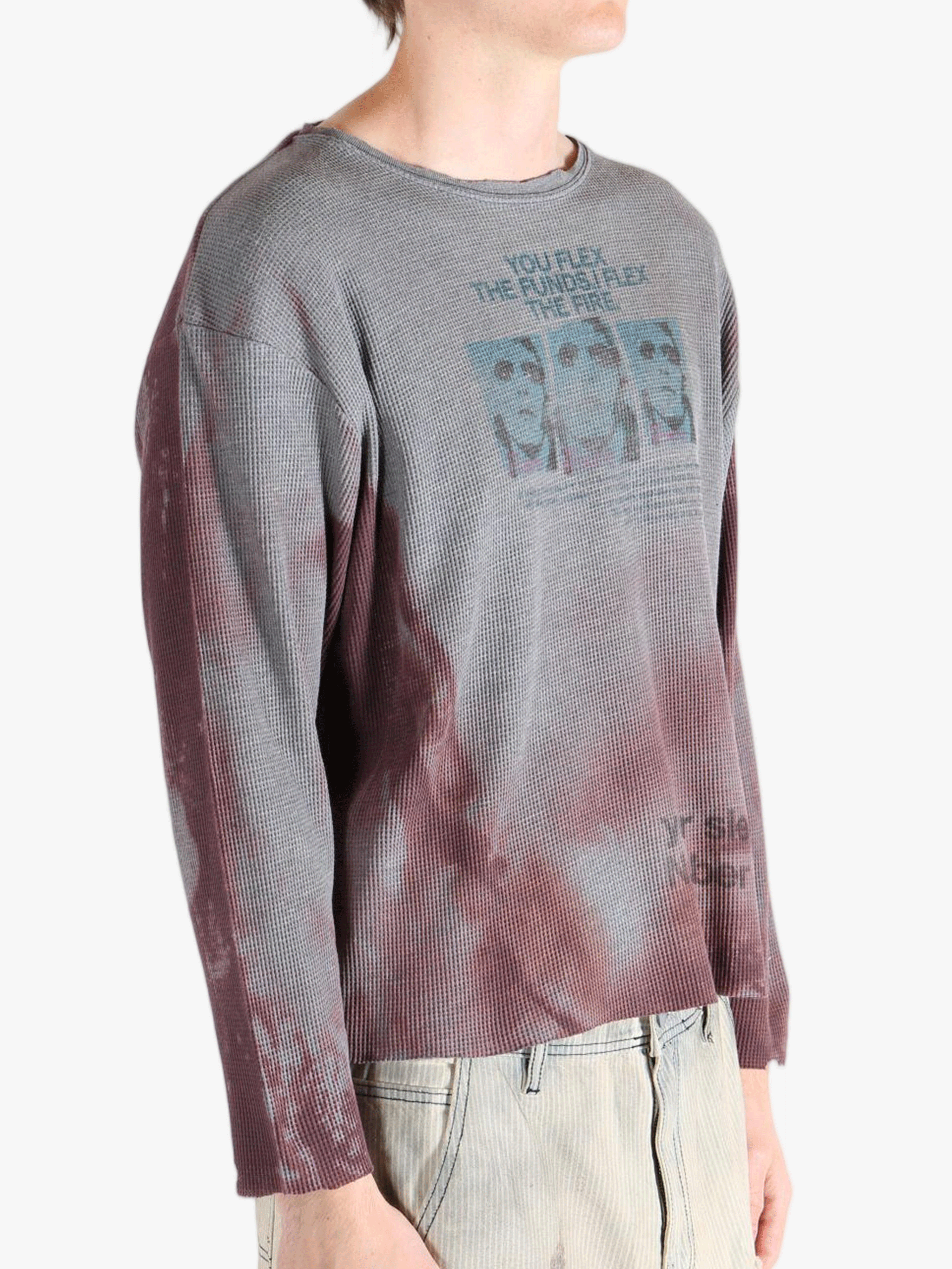 Grey top worn by a person, showing the top'sfit