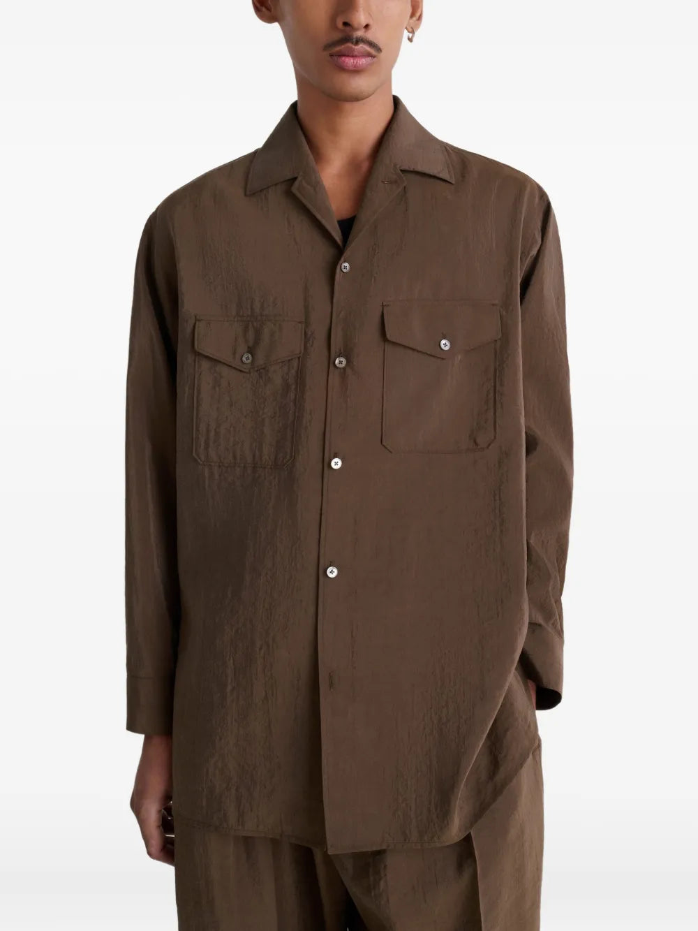 Brown shirt worn by a person, showing the shirt's fit