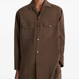 Brown shirt worn by a person, showing the shirt's fit