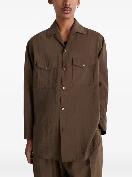Brown shirt worn by a person, showing the shirt's fit