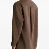 Brown shirt worn by a person, showing the shirt's fit