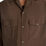 Close up of brown shirt,showing texture of the silk fabric.