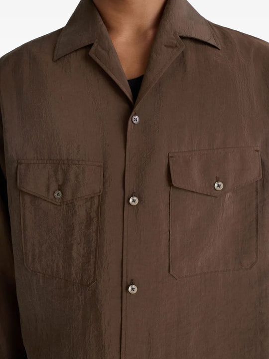 Close up of brown shirt,showing texture of the silk fabric.
