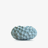 Ann Shure ceramic stone vase in azure glaze, front view showing cratered hand-built texture.