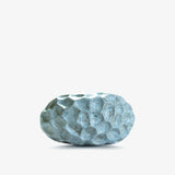 Ann Shure ceramic stone vase in azure glaze, back view showing carved faceted texture.