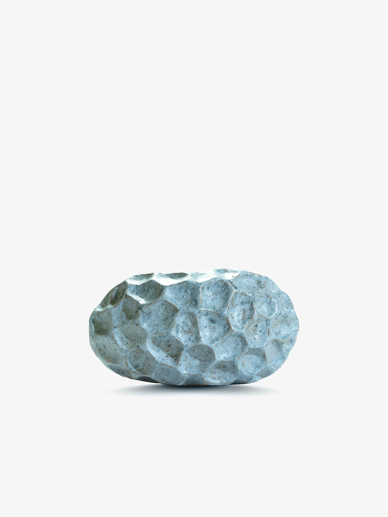 Ann Shure ceramic stone vase in azure glaze, back view showing carved faceted texture.