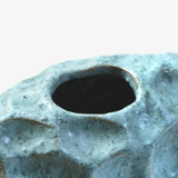 Ann Shure ceramic stone vase close-up showing opening, glossy glaze finish, and cratered detail.