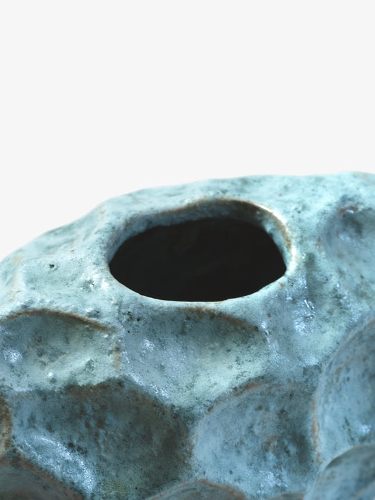 Ann Shure ceramic stone vase close-up showing opening, glossy glaze finish, and cratered detail.