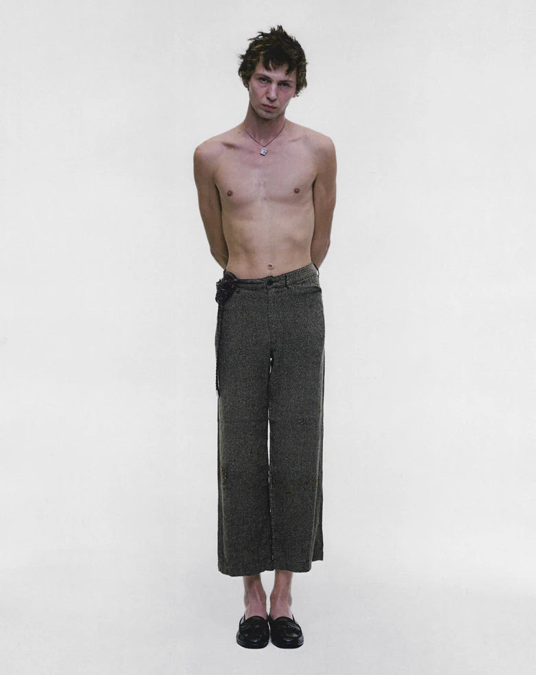 Grey pants worn by a person, showing the pants fit
