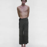 Grey pants worn by a person, showing the pants fit