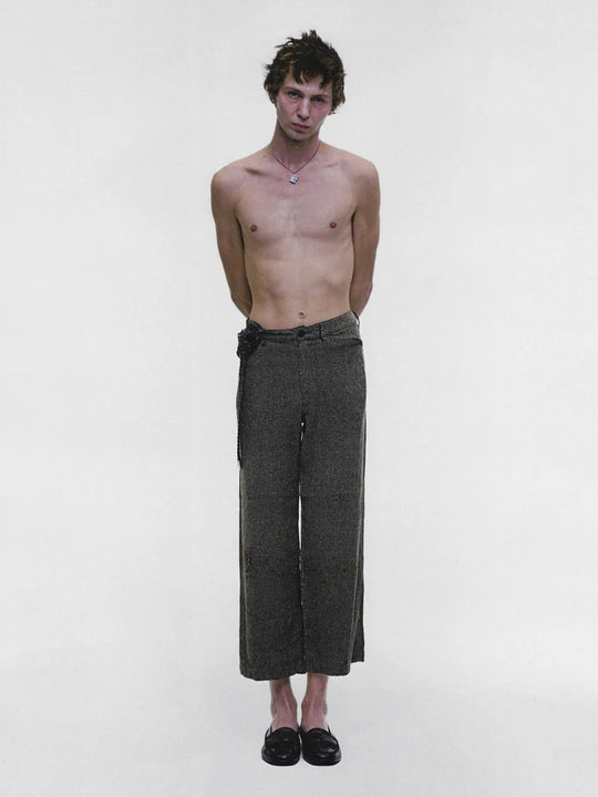 Grey pants worn by a person, showing the pants fit
