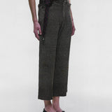 Grey pants worn by a person, showing the pants fit