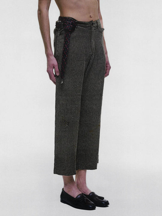 Grey pants worn by a person, showing the pants fit