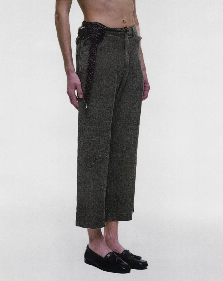 Grey pants worn by a person, showing the pants fit