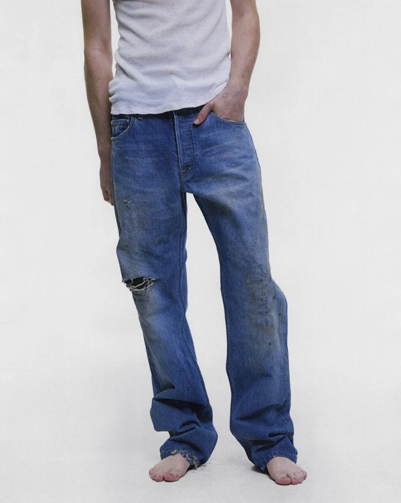 Blue jeans worn by a person, showing the jeans fit