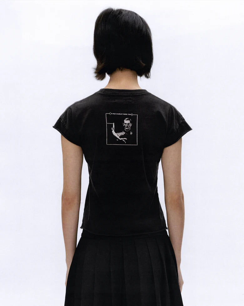Black t-shirt worn by a person, showing the t-shirt fit