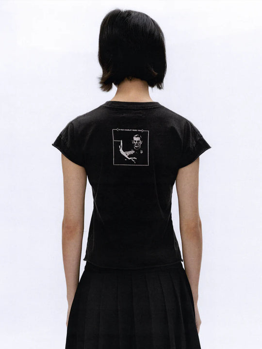 Black t-shirt worn by a person, showing the t-shirt fit