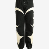 Black pants worn by a person, showing the pants' fit
