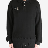 Black T-shirt worn by a person, showing the shirt's fit