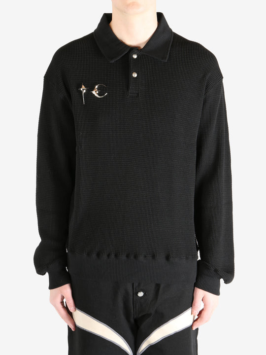 Black T-shirt worn by a person, showing the shirt's fit