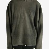 Green hoodie worn by a person, showing the hoodie's fit