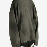 Green hoodie worn by a person, showing the hoodie's fit