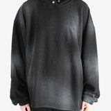 Black hoodie worn by a person, showing the hoodie's fit