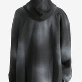 Black hoodie worn by a person, showing the hoodie's fit