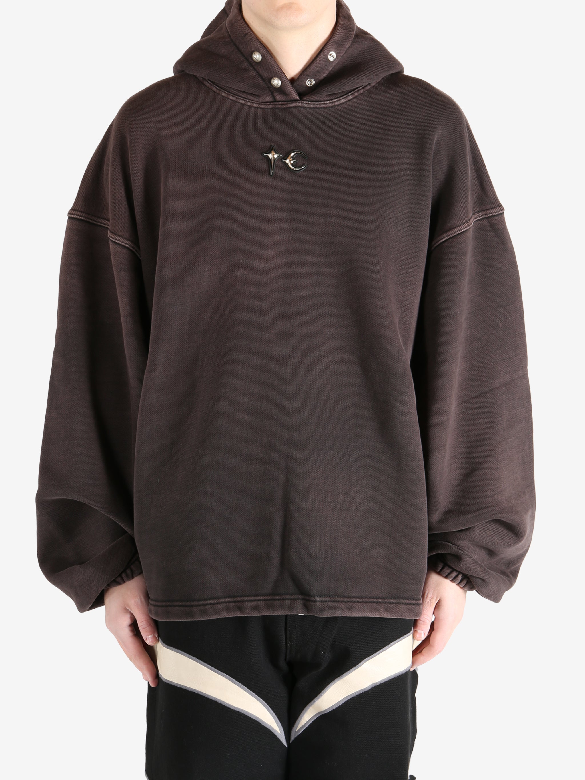 Black hoodie worn by a person, showing the hoodie's fit