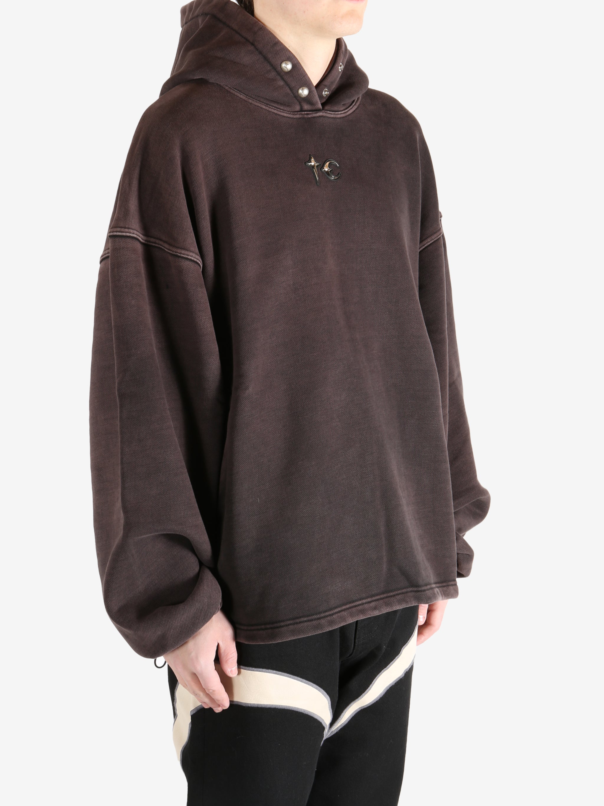 Black hoodie worn by a person, showing the hoodie's fit