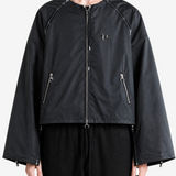 Black jacket worn by a person, showing the jacket fit